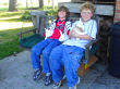 Two of the grandkids enjoy the bunnie's company on the porch swing.