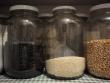 Gallon-size glass jars in the pantry.