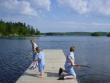 Grandsons playing on a dock at Shagawa Lake, Ely, Minnesota.