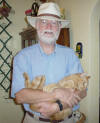 Bob, about 50 pounds lighter, holding Curry Cat.
